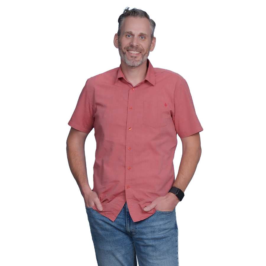 Justin Moss standing in a casual pose.