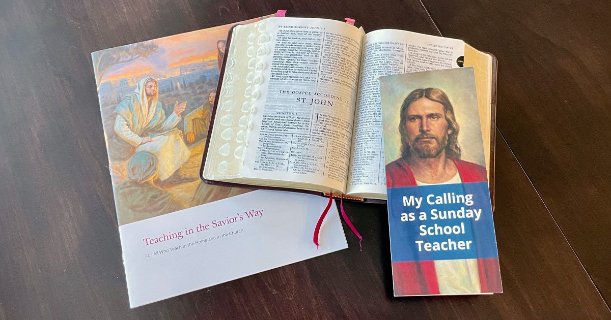 Open scriptures with Teaching in the Savior’s Way manual and a Sunday School teacher pamphlet on a wooden table