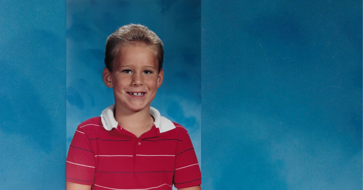 Second grade school portrait of Justin Moss used as the featured image for an essay about childhood trauma, guilt, and emotional responsibility.